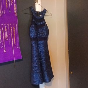 A navy blue sparkly homecoming dress that is size small.